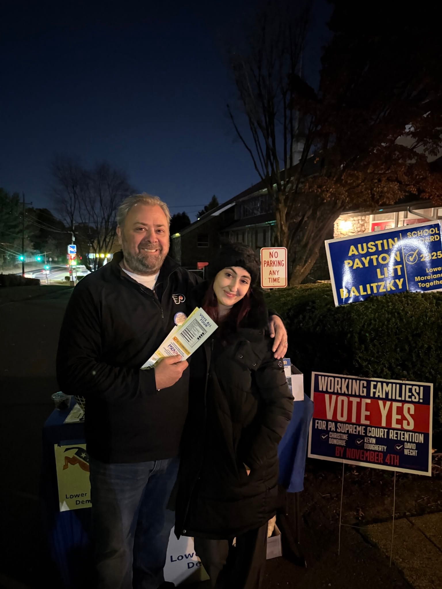 Community members volunteering at an evening campaign event
